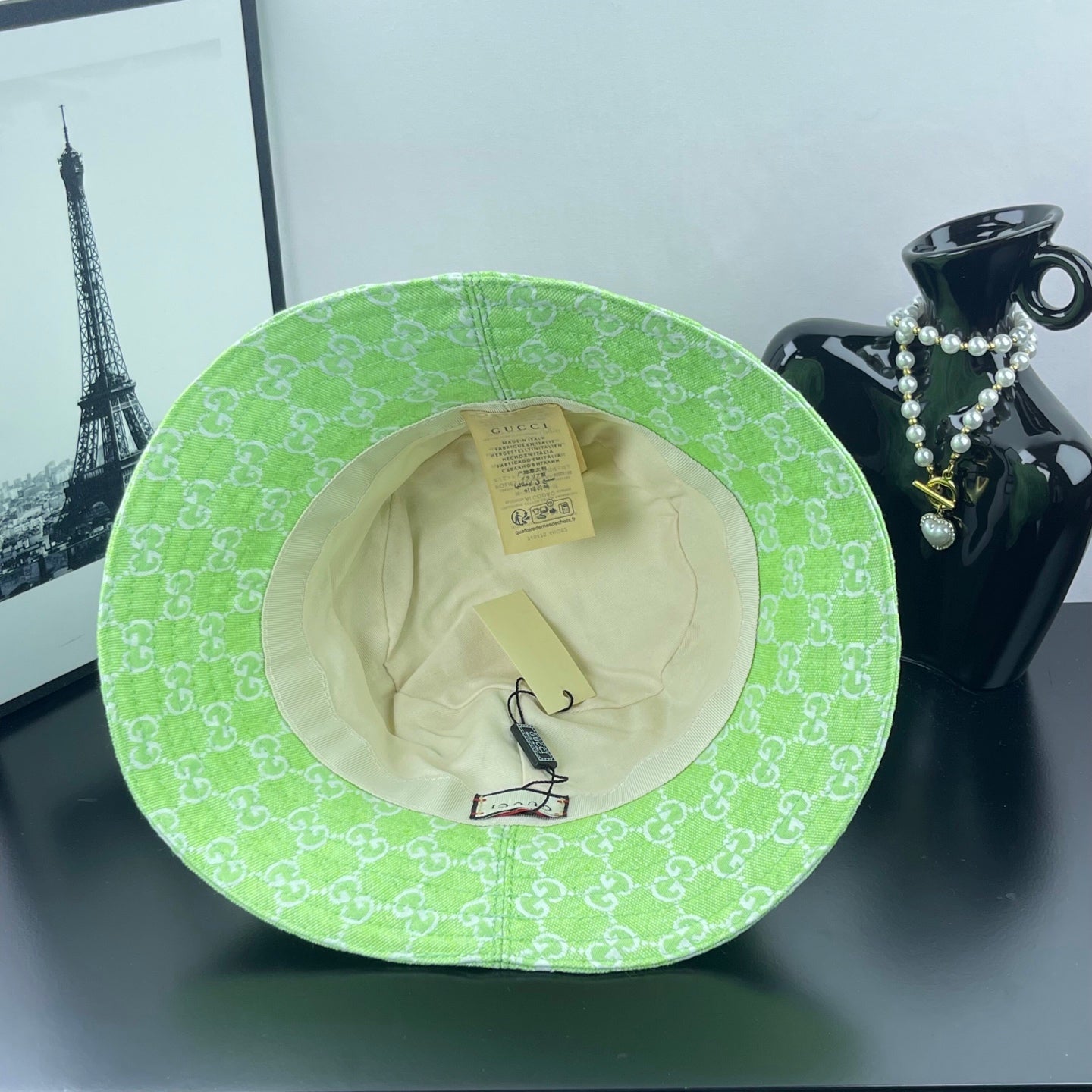 Lime green Gucci bucket hat interior with beige lining and visible size tag
