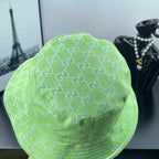 Lime green Gucci bucket hat side view with allover GG monogram pattern