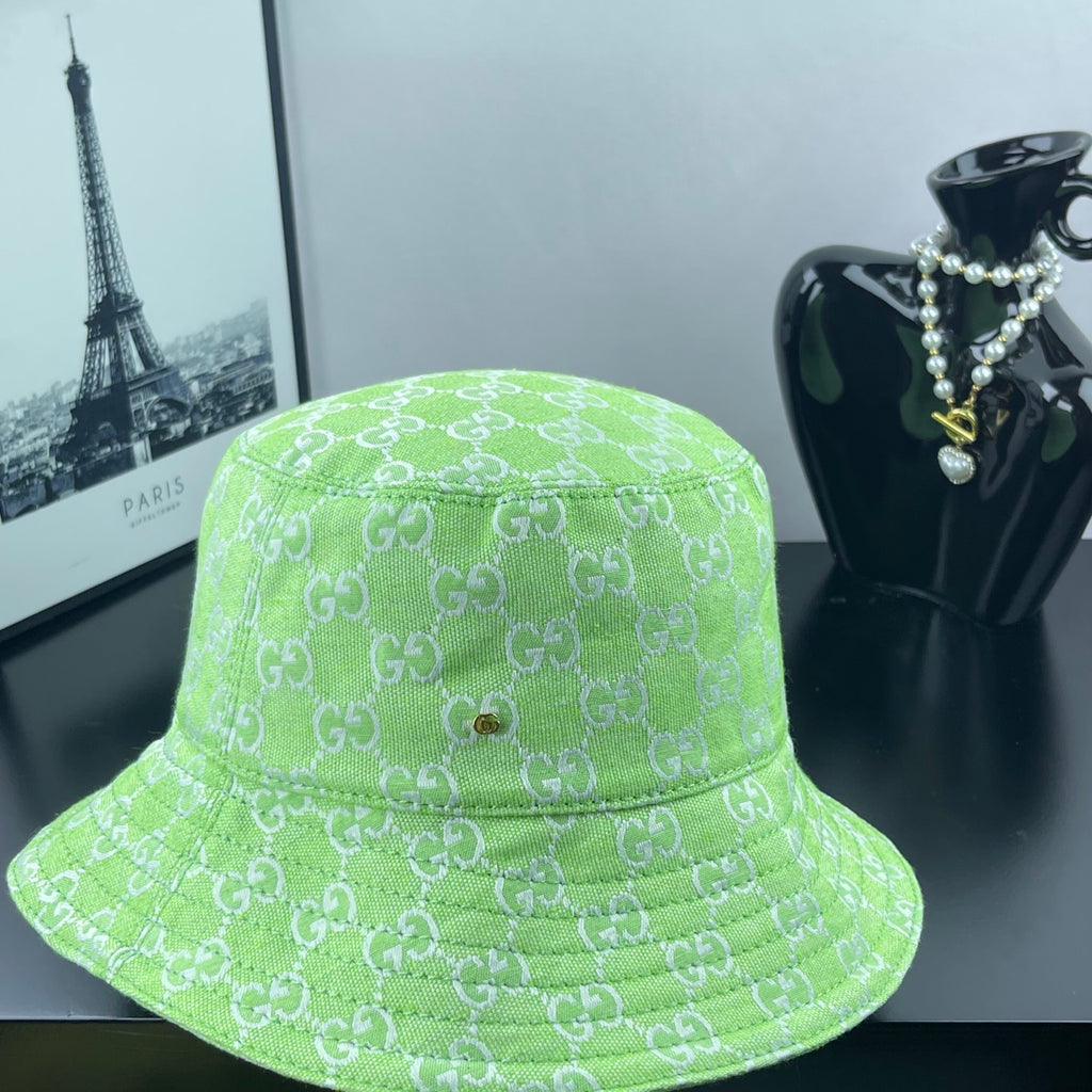Lime green Gucci bucket hat front view with GG monogram pattern and small gold button