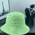 Lime green Gucci bucket hat front view with GG monogram pattern and small gold button