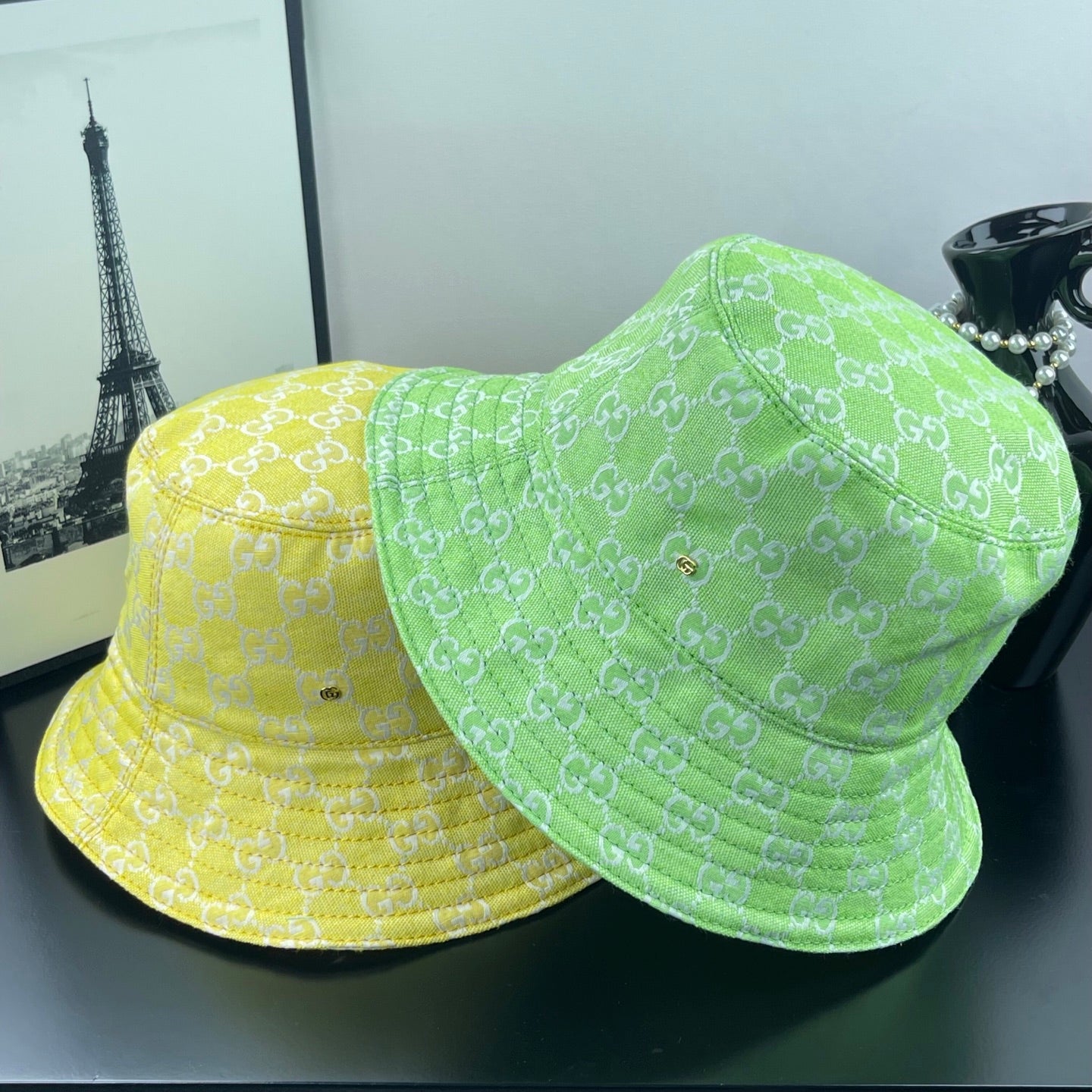 Gucci bucket hats pair in lime green and yellow with GG monogram pattern and brims
