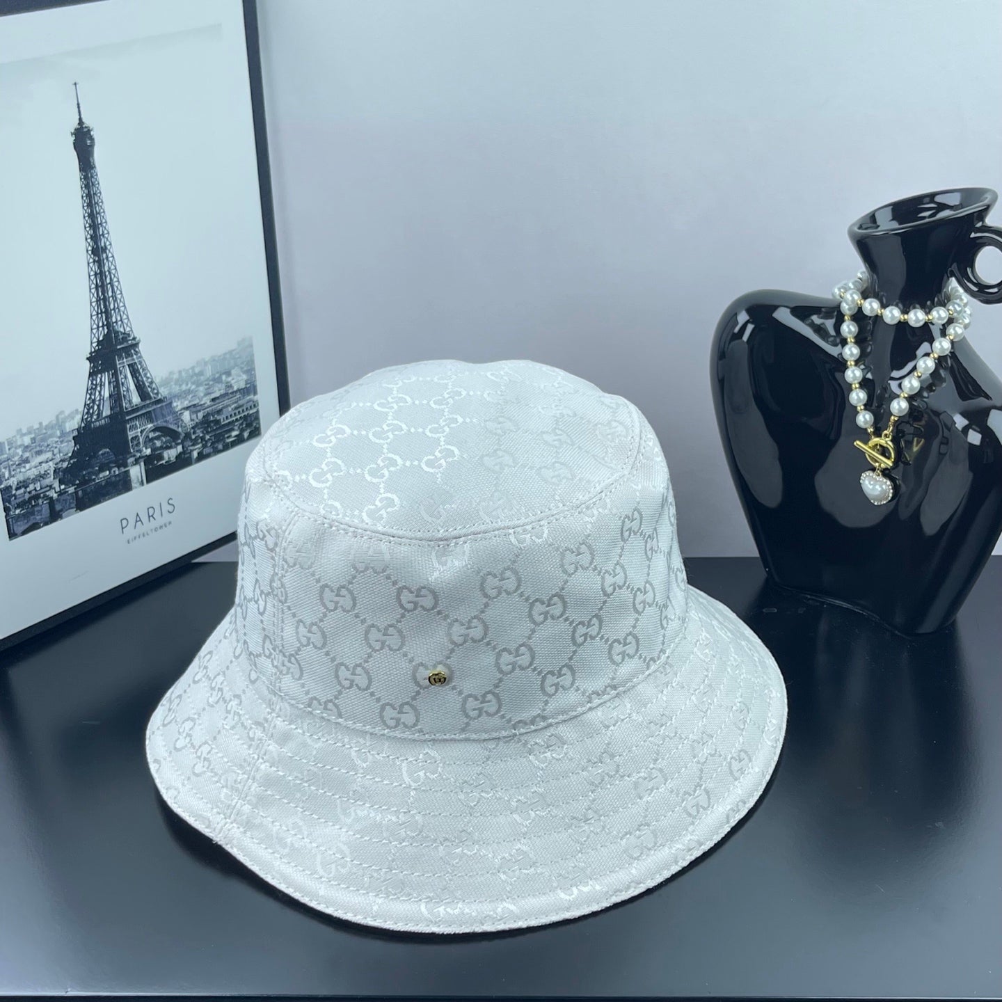 Gucci white GG monogram bucket cap with stitched brim and small gold rivet