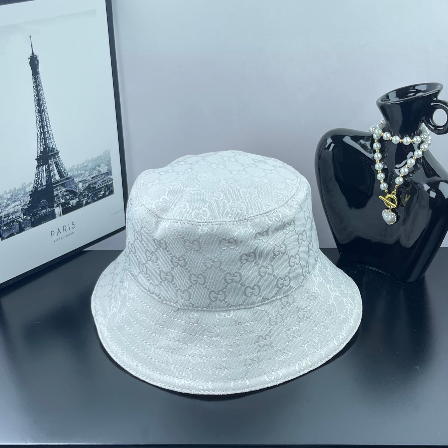 Gucci white GG monogram bucket cap, textured pattern, curved brim and top seam