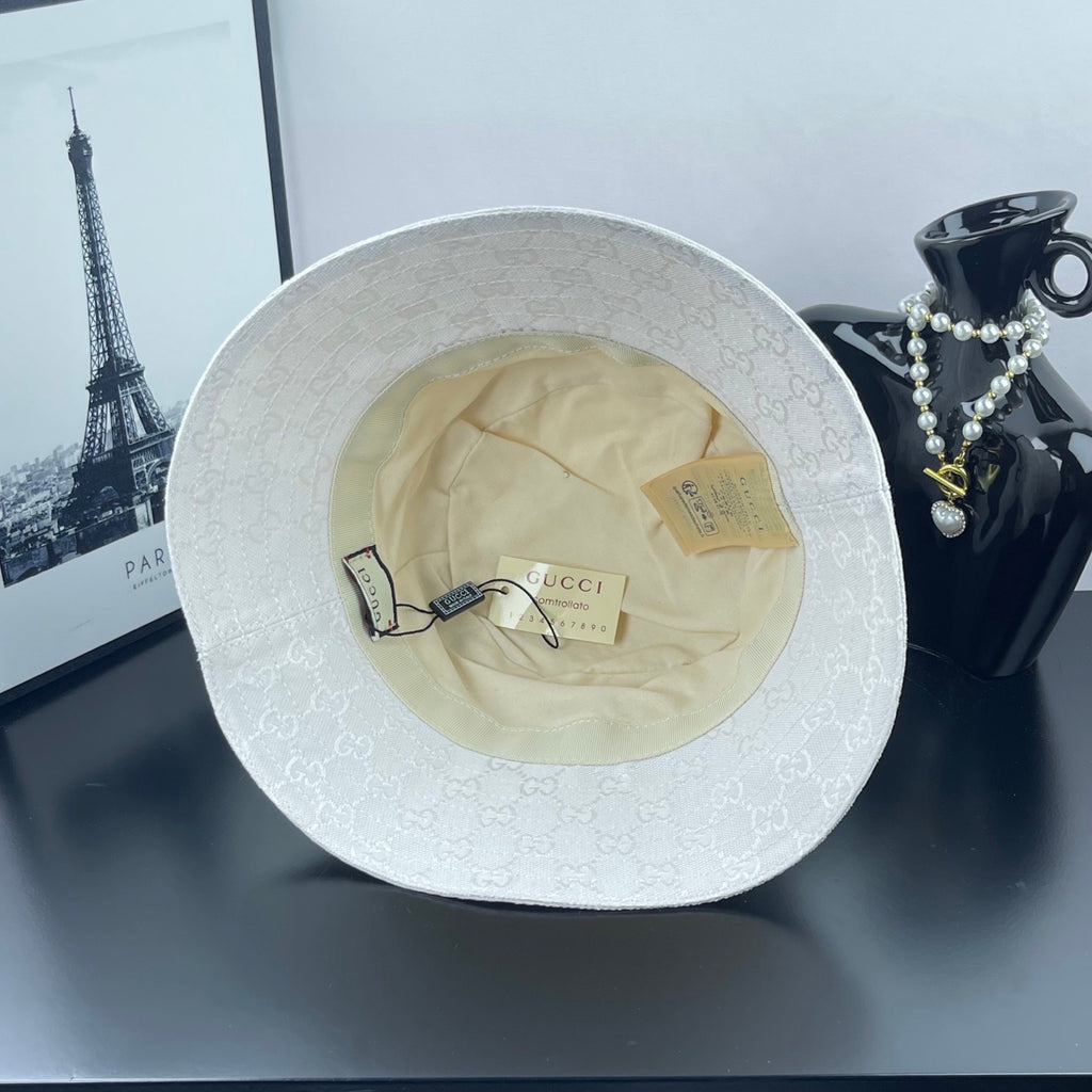 Gucci white bucket cap interior with beige lining and hanging label