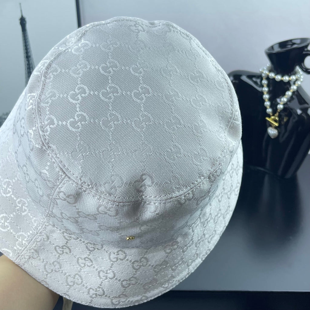 Gucci white GG monogram bucket cap, close view of crown and brim seam