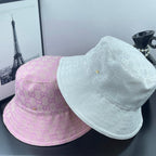 Gucci white and pink GG monogram bucket caps with curved brims and stitched crowns