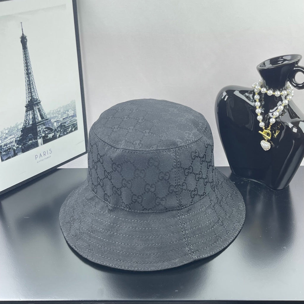 Gray GG monogram bucket hat with stitched brim and gold logo