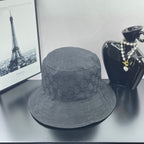 Gray GG monogram bucket hat with stitched brim and gold logo