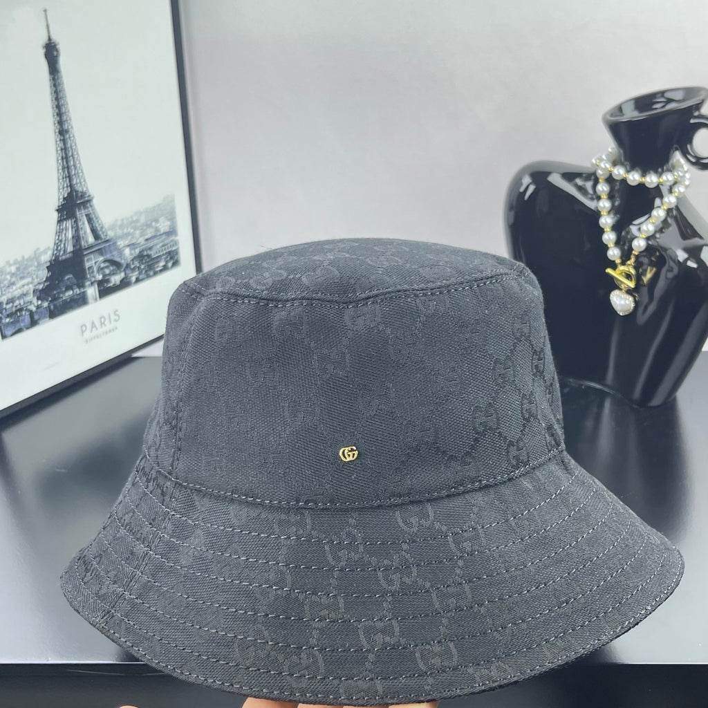 Gray GG monogram bucket hat, front view, small gold GG pin