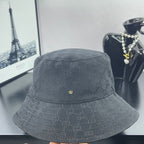 Gray GG monogram bucket hat, front view, small gold GG pin