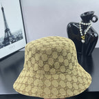 Gucci GG monogram bucket cap, tan with dark brown pattern, front view