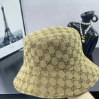Gucci GG monogram bucket cap, tan with dark brown pattern, three-quarter view