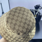 Gucci GG monogram bucket cap, tan with dark brown pattern, close-up top