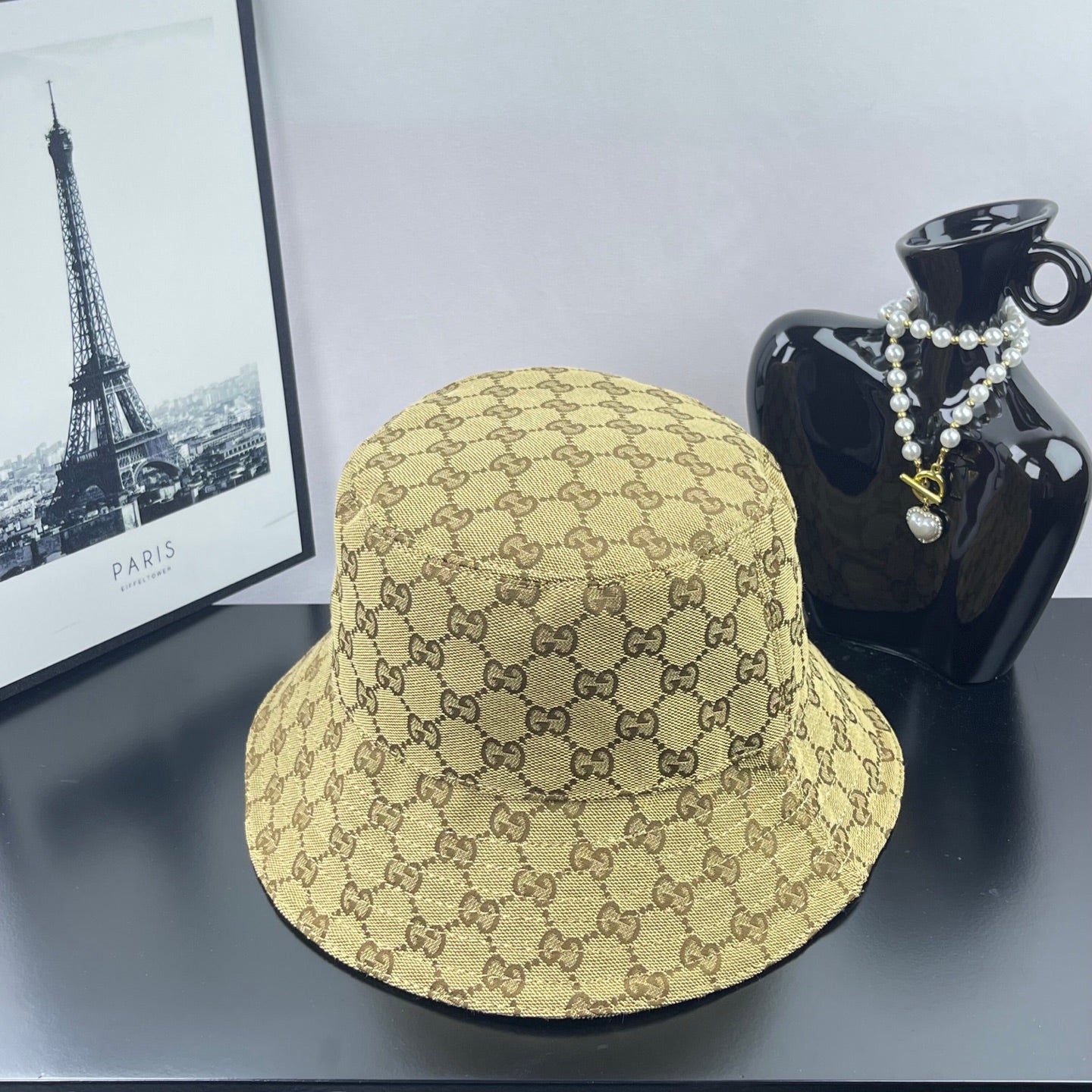 Gucci GG monogram bucket cap, tan with dark brown allover pattern, side view