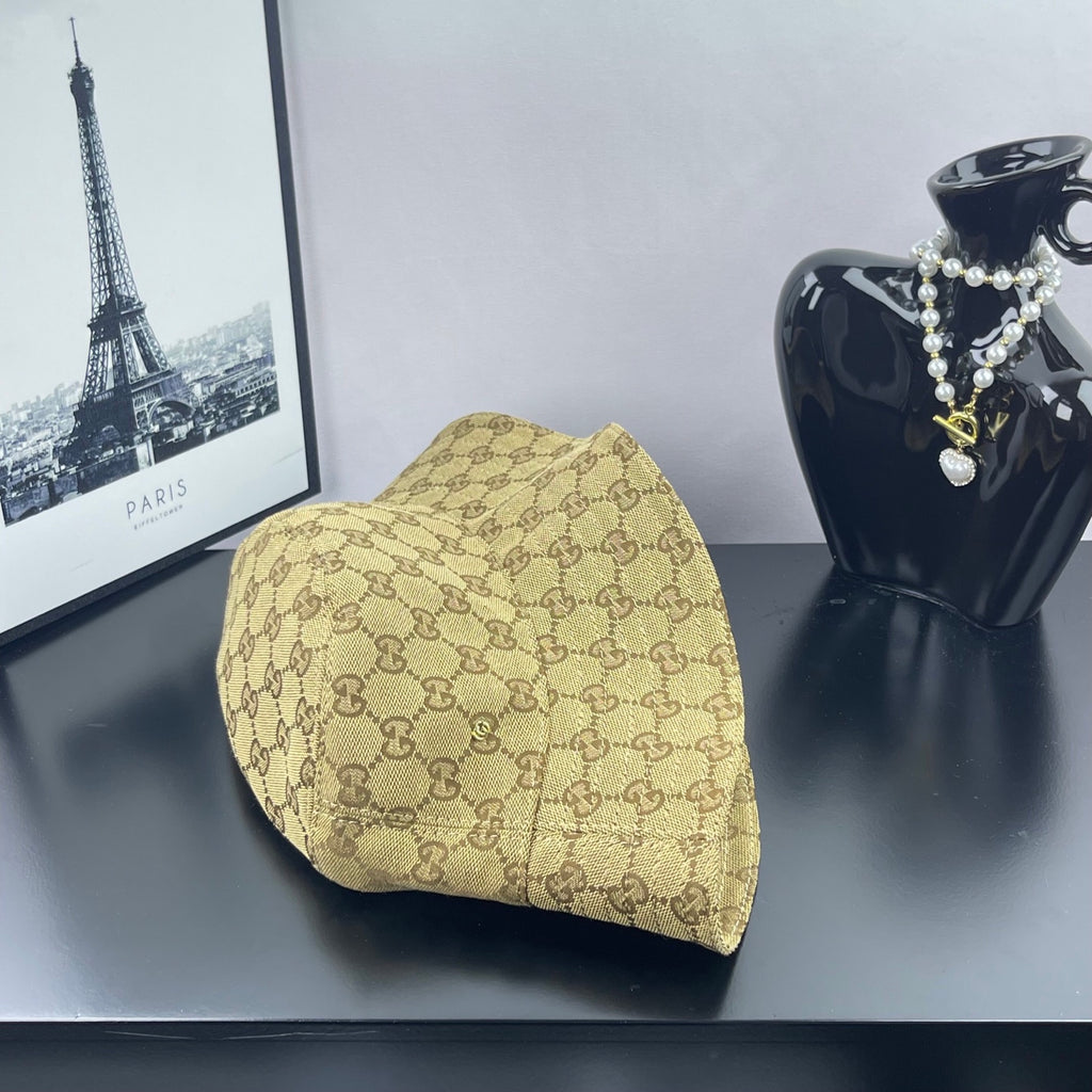 Gucci GG monogram bucket cap, tan with dark brown pattern, side profile