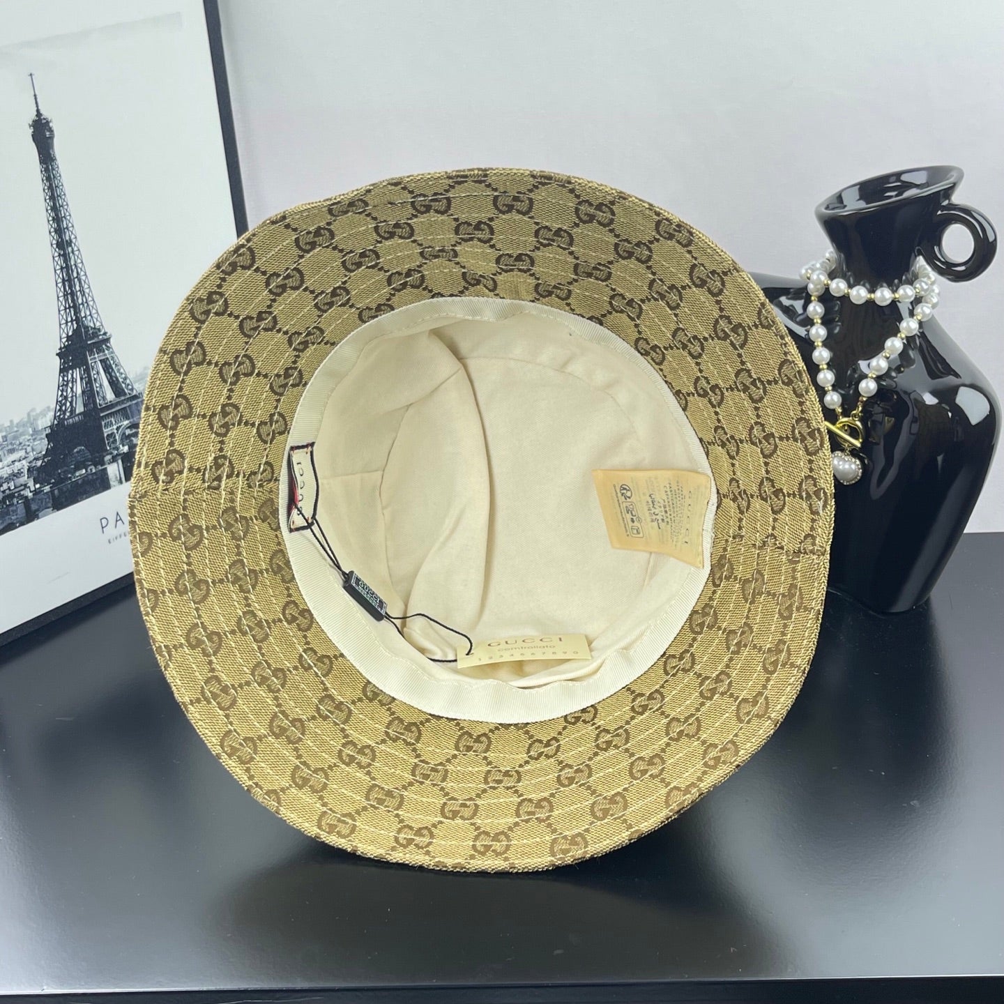 Gucci GG monogram bucket cap, tan; interior beige lining visible from underside