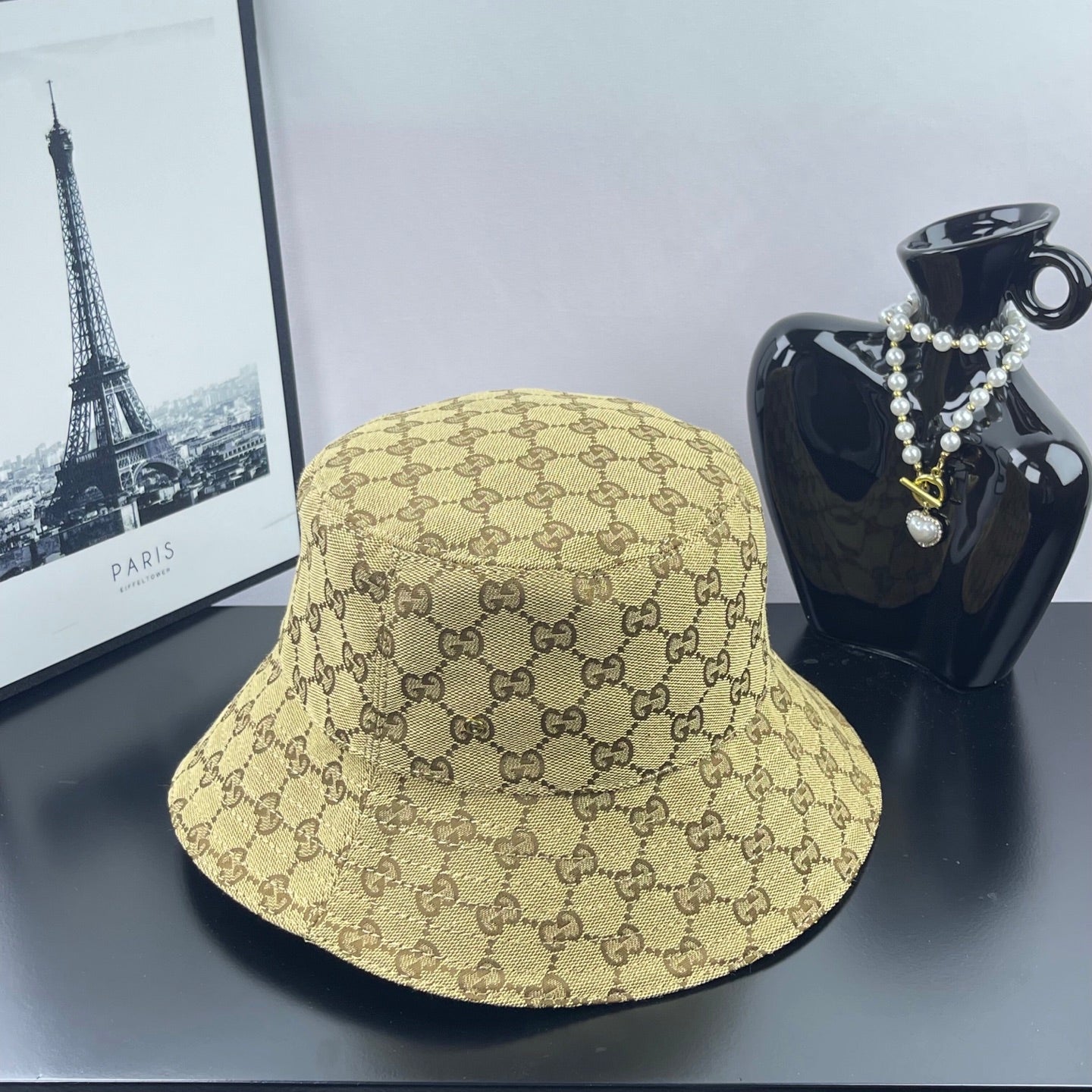Gucci GG monogram bucket cap, tan with dark brown pattern and curved brim