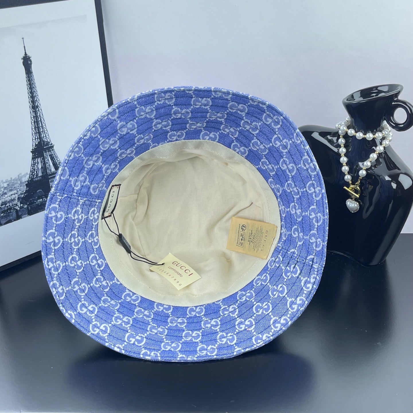 Blue GG monogram bucket hat showing inner beige lining