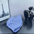 Blue GG monogram bucket hat, side angle with folded brim