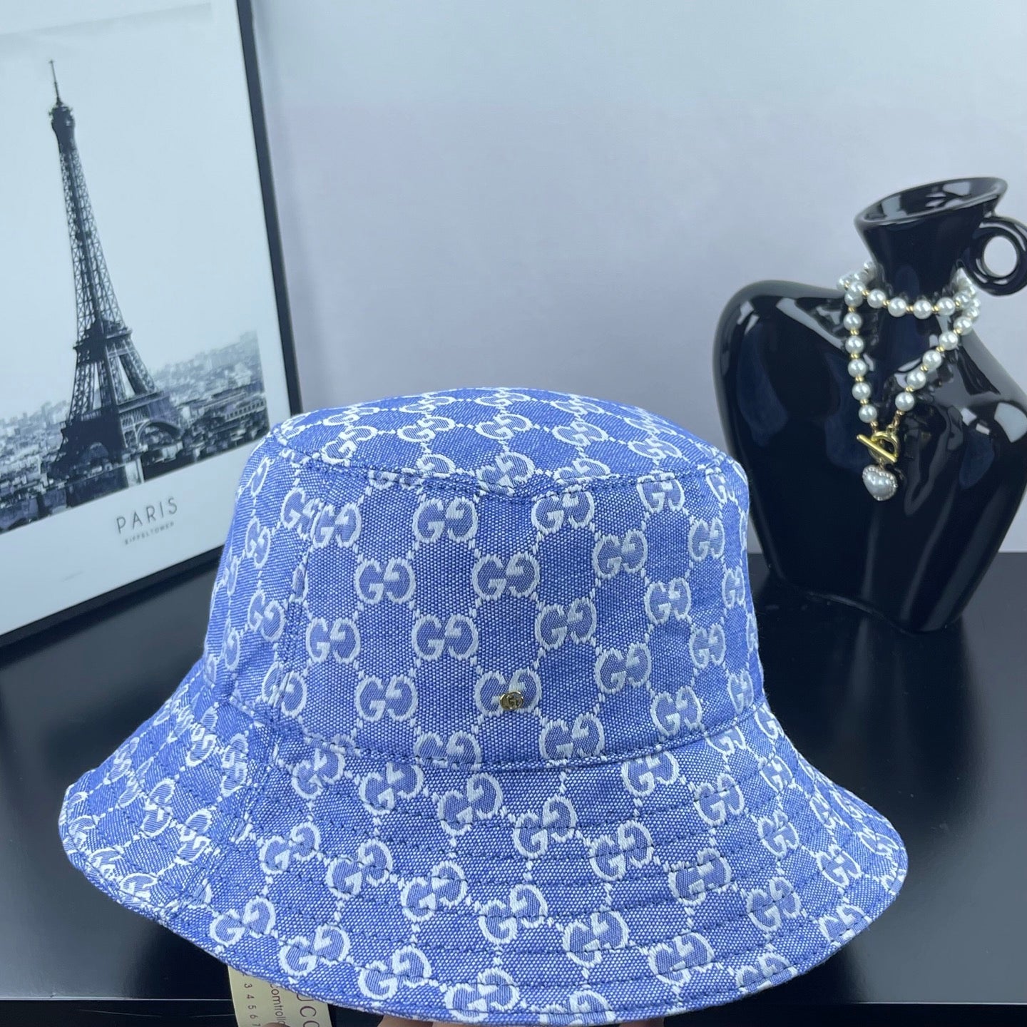 Blue GG monogram bucket hat, front view with wide brim