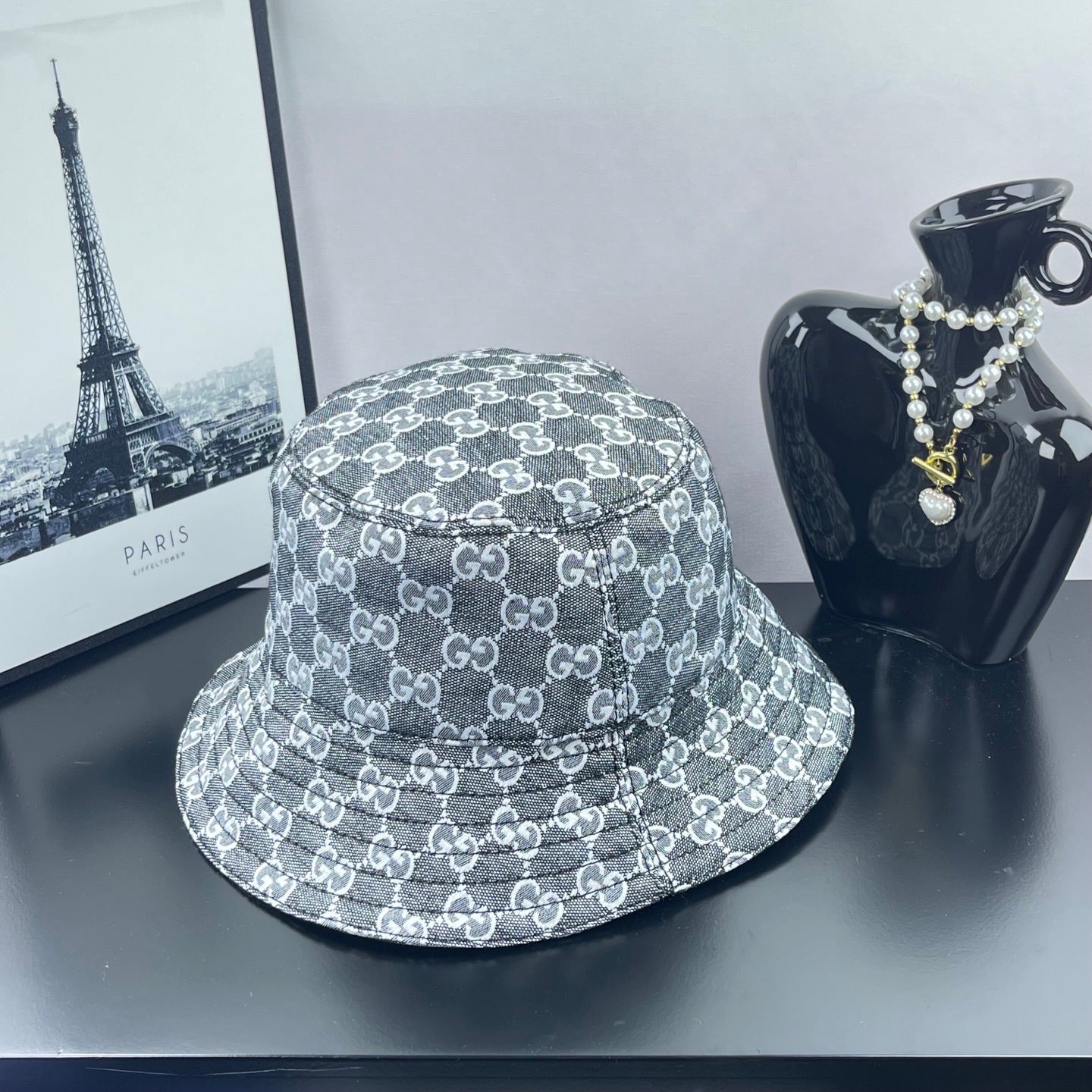 Gucci GG-print bucket hat in dark gray, wide stitched brim