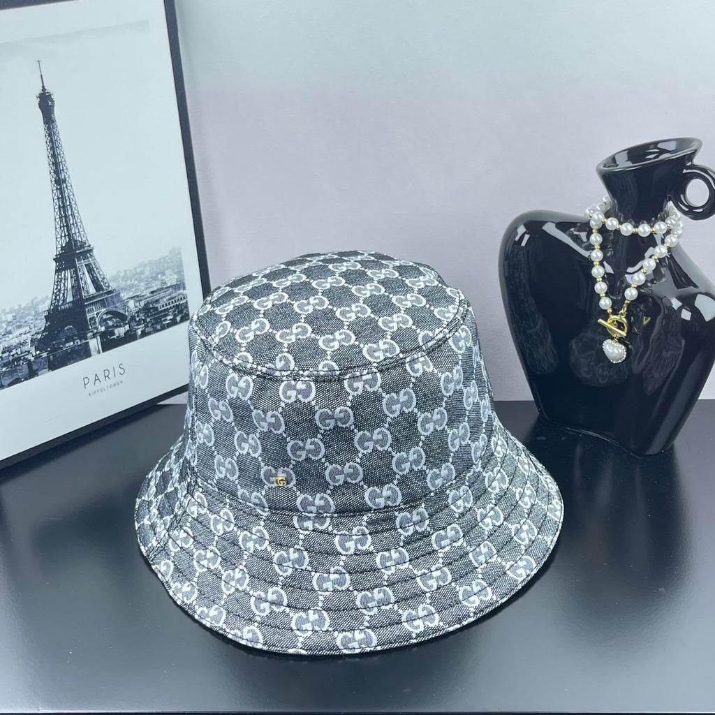 Gucci GG-print bucket hat, dark gray with repeating white logos and stitched brim