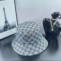Gucci GG-print bucket hat, dark gray with repeating white logos and stitched brim
