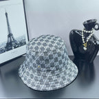 Gucci GG-print bucket hat, dark gray with repeating white logos and stitched brim