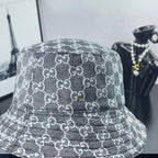 Gucci GG-print bucket hat, dark gray with stitched logo pattern across crown