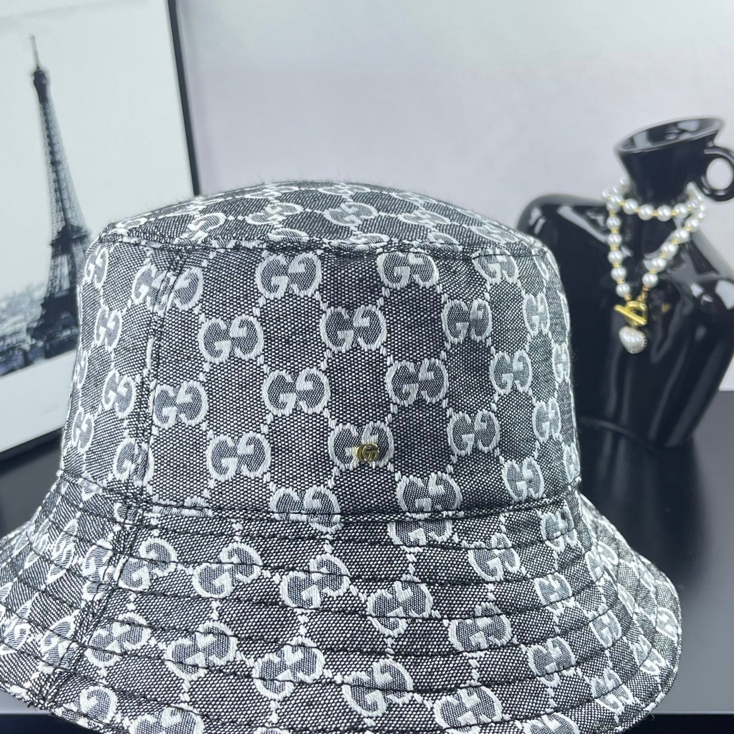 Gucci GG-print bucket hat, dark gray with stitched logo pattern across crown