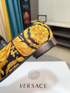 Floral loafer with black heel and band, yellow blossoms on dark upper.
