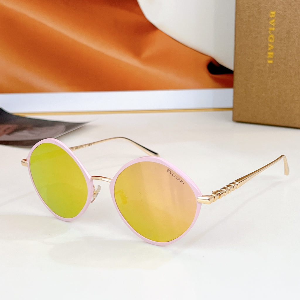 Round sunglasses with pink rim and mirrored yellow lenses, gold-tone temples.