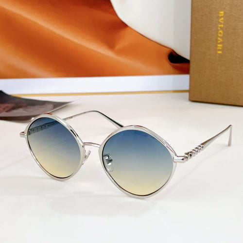Round sunglasses with silver-tone frame and mirrored blue lenses, gold-tone temples.