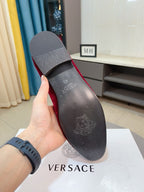 Black loafer outsole with embossed logo on heel and forefoot