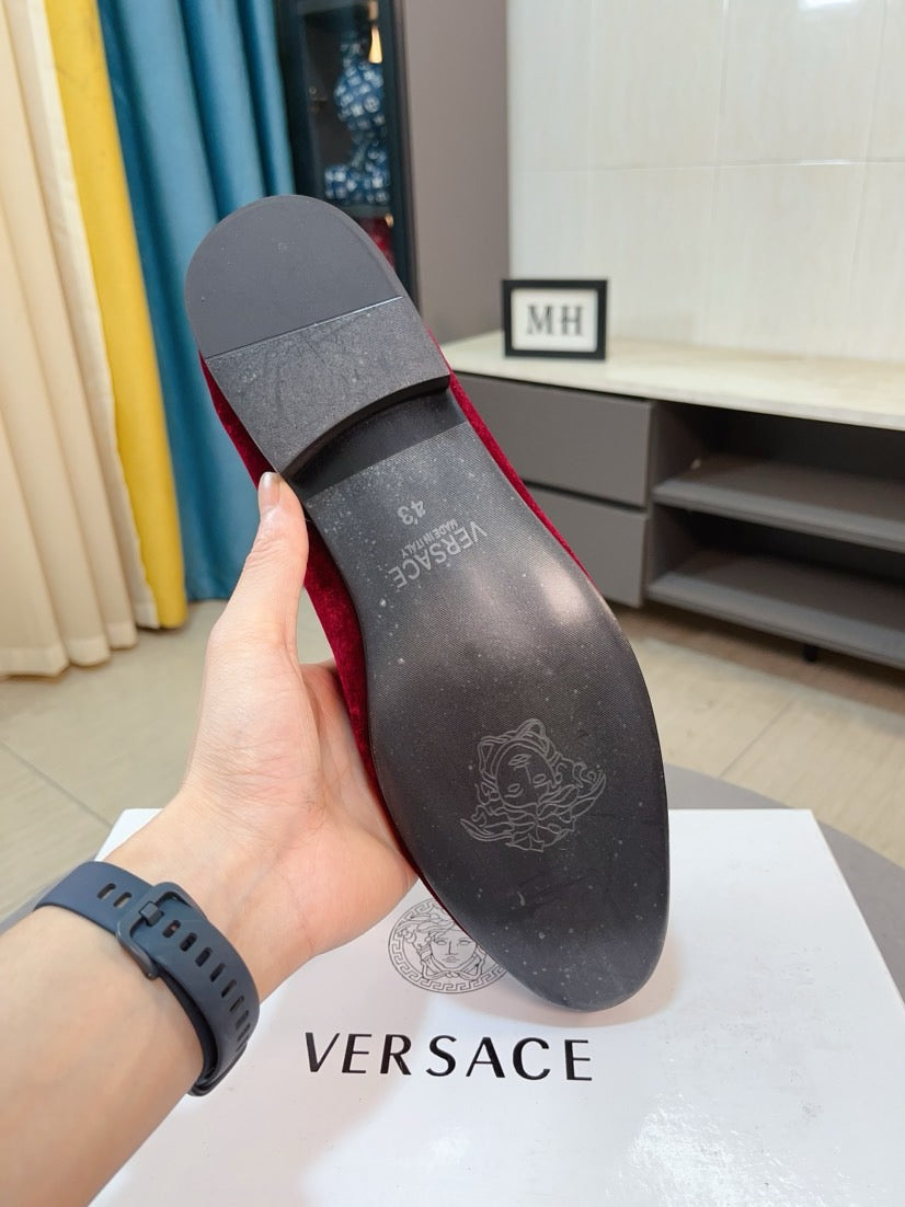 Black loafer outsole with embossed logo on heel and forefoot