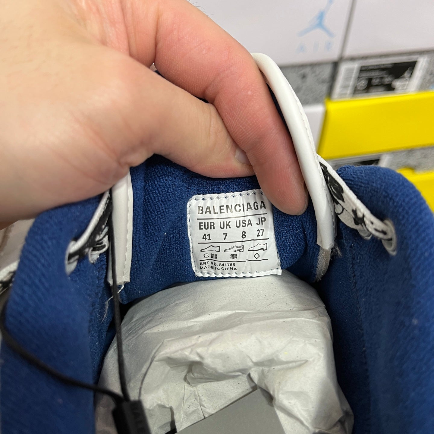 Blue-lined sneaker interior with Balenciaga size label and stitched collar