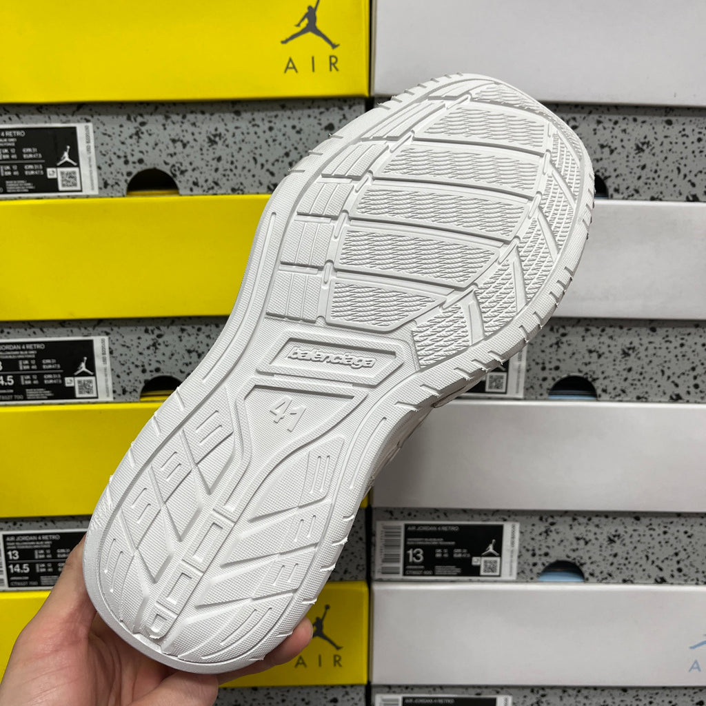 White sneaker outsole with detailed traction tread pattern