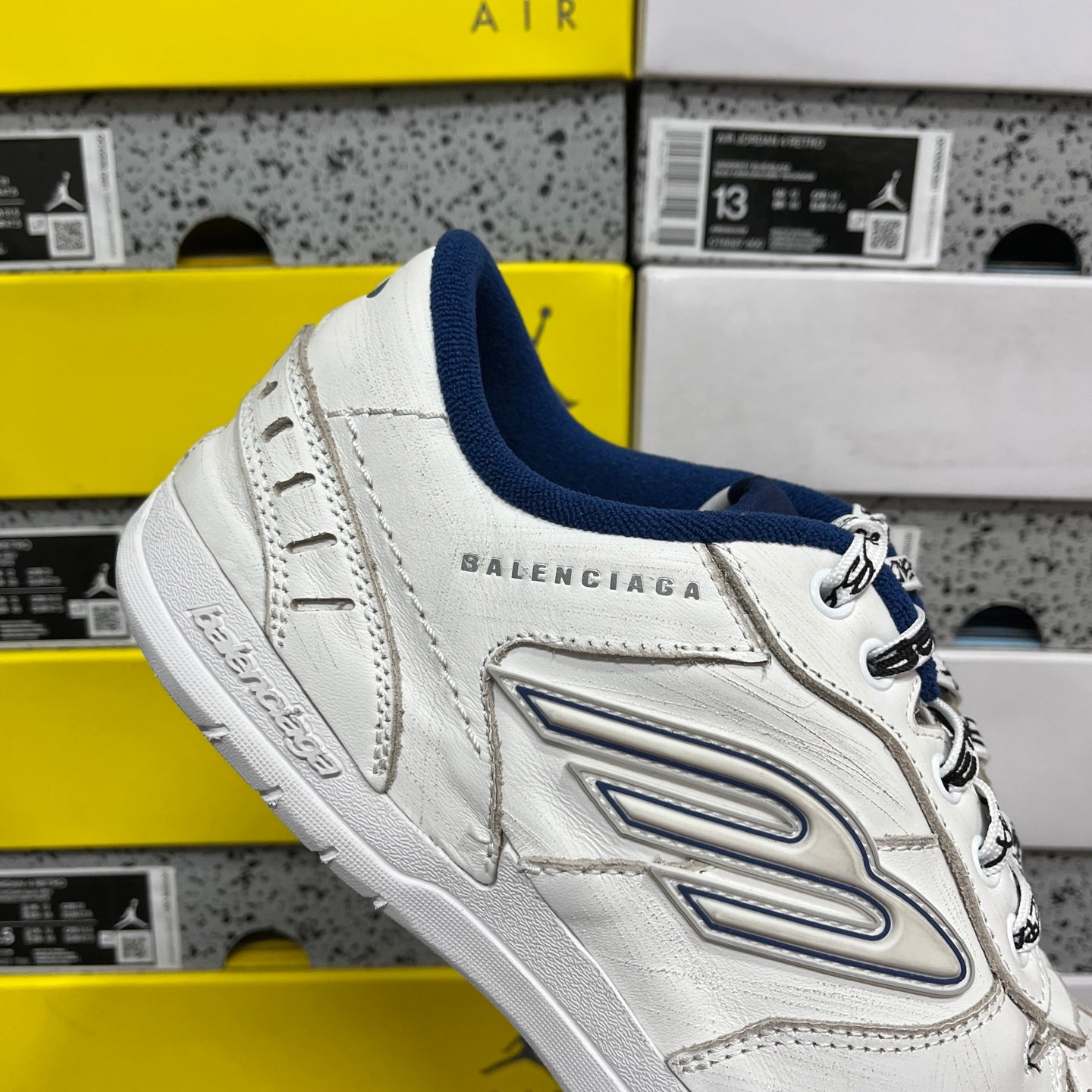 White Balenciaga unisex sneaker with blue lining, lace-up and side logo panel