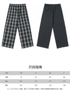 Pants size chart with two styles shown: plaid and solid navy, XS to L measurements