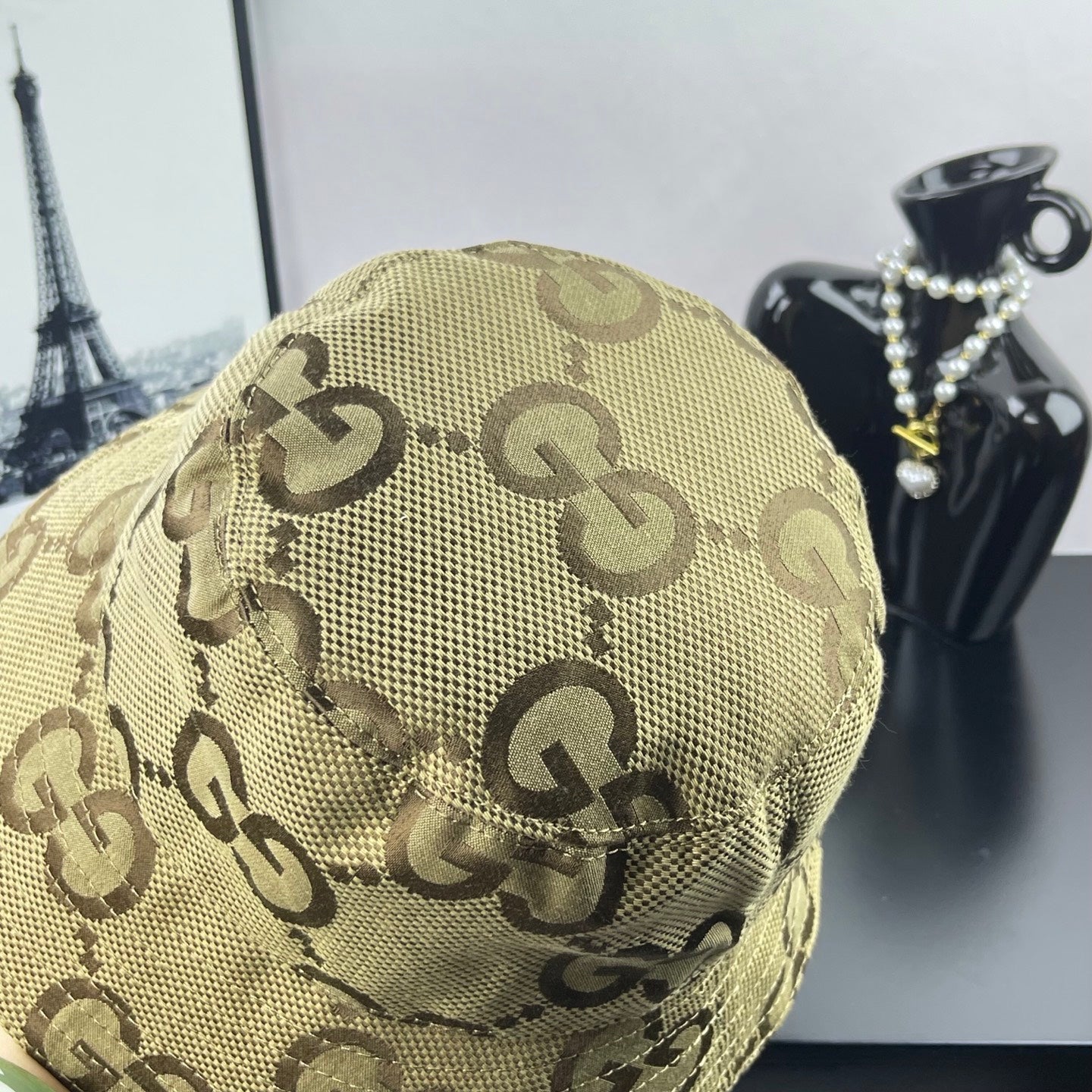 Gucci GG monogram bucket hat in beige canvas, close-up front panel and curved brim