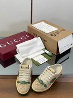 Low-top sneakers with beige canvas, green and red web stripe, white lace-up front