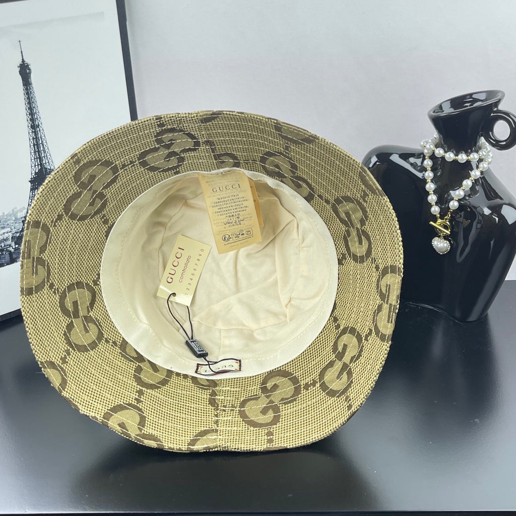 Gucci GG monogram bucket hat with beige outer shell and white inner lining