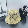 Gucci GG monogram bucket hat in beige canvas with wide brim and stitched pattern