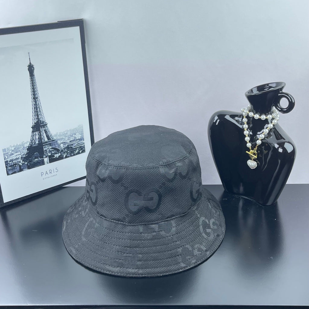 Gucci bucket hat in dark gray with allover GG monogram pattern and stitched brim