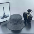 Gucci bucket hat in dark gray with allover GG monogram pattern and stitched brim