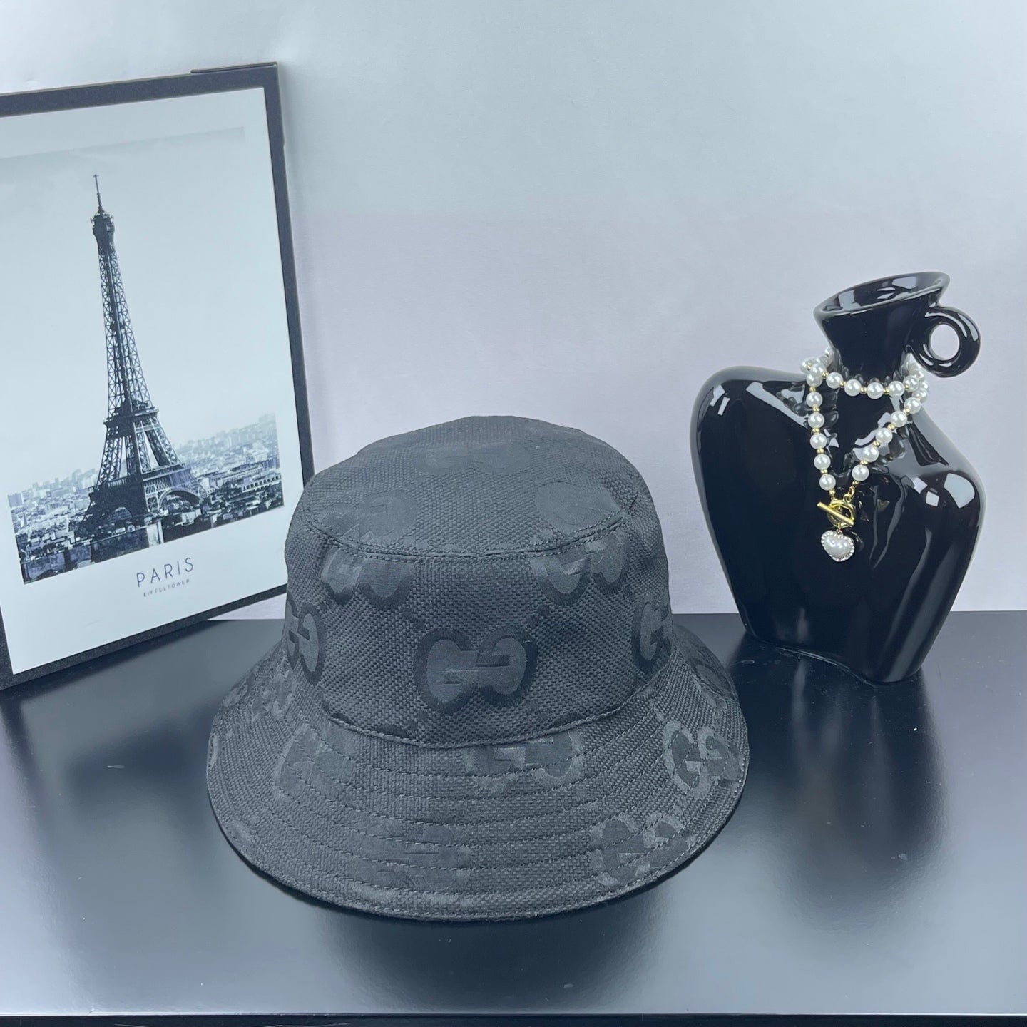 Gucci bucket hat in dark gray with allover GG monogram pattern and stitched brim