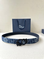 Blue Dior belt with monogram pattern and ornate black buckle, adjustable holes.