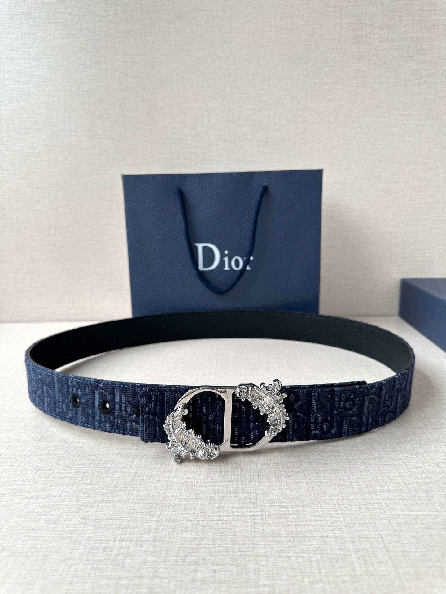 Dior belt in dark blue with monogram pattern and silver-tone ornate buckle