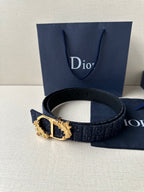 Dior belt with dark blue monogram strap and gold-tone buckle featuring oval inset