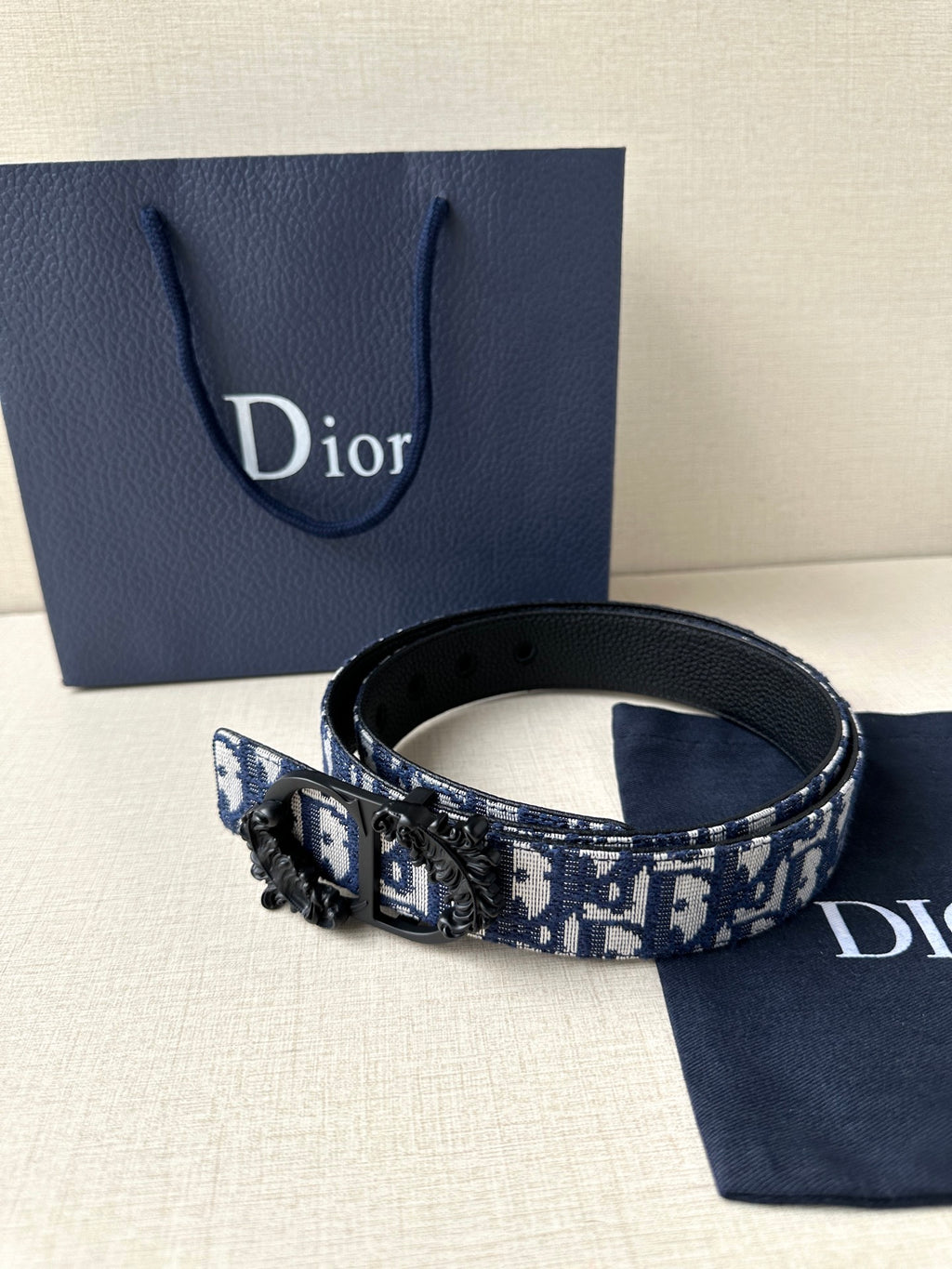 Dior belt with blue monogram strap, black leather trim, and Dior buckle